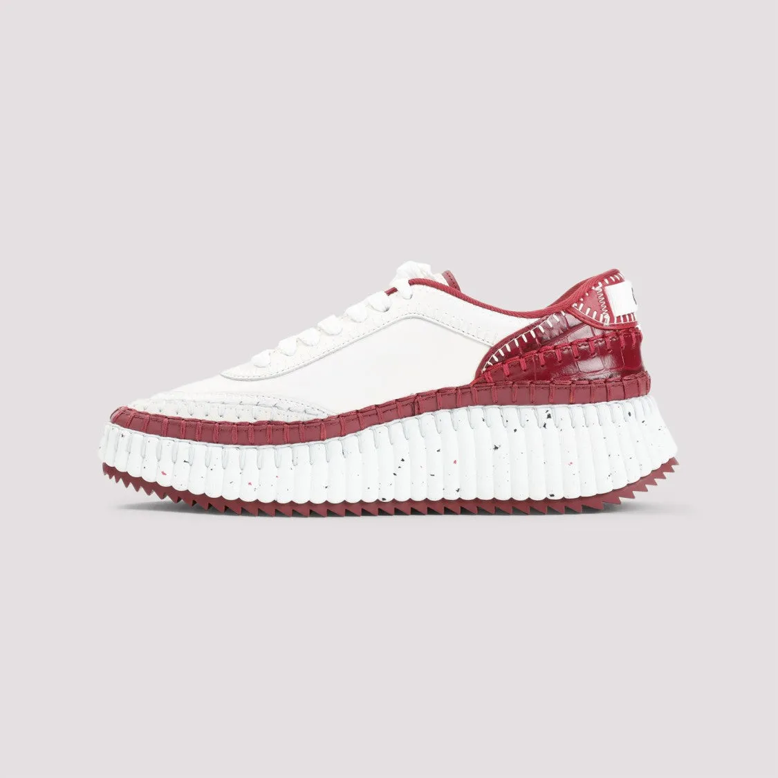 Red Leather Sneakers With Textured Sole And Elegant Accents